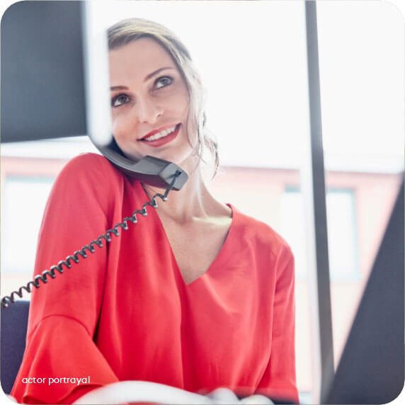 Woman talking on phone reflects Patient Access Manager speaking to HCPs about free 14-day supply of prescription with Acadia Connect™ enrollment